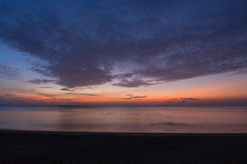 Fototapeta na wymiar Dramatic sky clouds again andaman sea in sunrise.