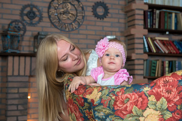 Year-old girl with her mother on the couch