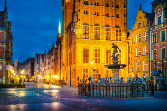 Beautifully illuminated Old Town in Gdansk with Neptune's statue. Poland, Pomerania.