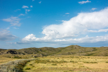 Beautiful landscape of mountains and blue sky with clouds.