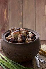 Grilled meat in clay pot