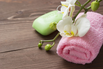 Obraz na płótnie Canvas Body care.Soap,white orhid and pink towel.Spa consept.