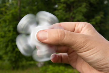 hand with fidget spinner