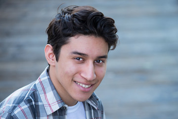 Teenage Hispanic boy, smiling 