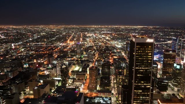 Aerial Time Lapse of Los Angeles Downtown Skyscrapers and Traffic at Night