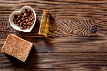 Homemade skin care. Coffee soap on wooden background top view copyspace