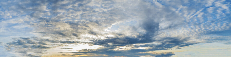 Vibrant color panoramic sun rise and sun set sky with cloud on a cloudy day. Beautiful cirrus cloud. Panorama high resolution photograph.