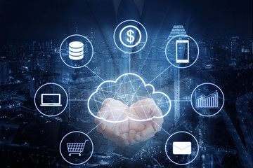 Double exposure of professional businessman hold cloud technology network and devices on hand with tablet and cityscape background in technology, communication and business concept in blue tone