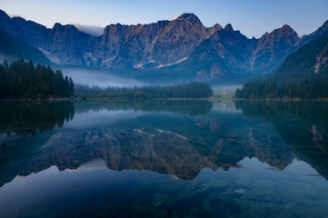 Fototapeta na wymiar Beautiful mountain lake Laghi Di Fusine in the morning