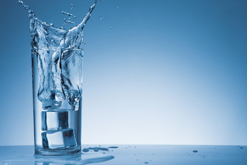 Water splash with bubble in glasses