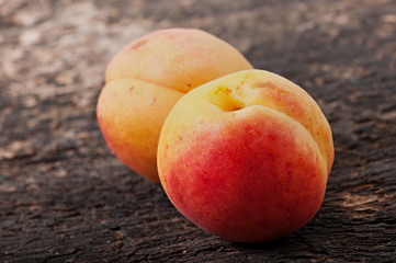 Fruits of apricots on an old wooden background, diet food.