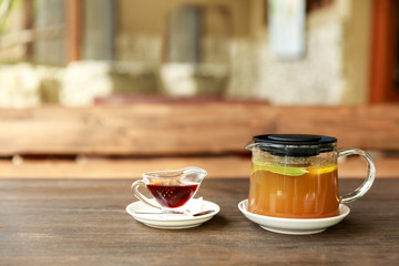 Herbal tea and pine cone jam, healthy drink on the wooden table
