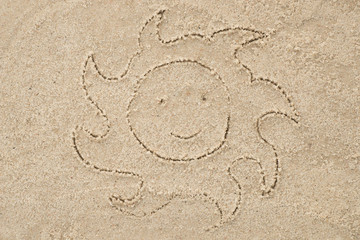 sun drawing in sand