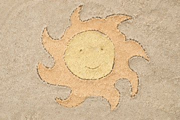 sun drawing in sand