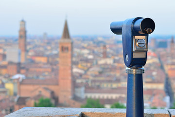 Telescope mounted on top Verona observation deck. View to Verona, Italy.