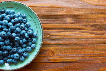 food plate of blueberries on wood