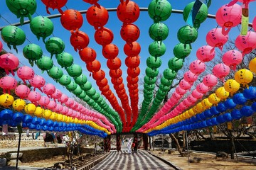 Colorful lanterns lining a walkway at a monastery in South Korea