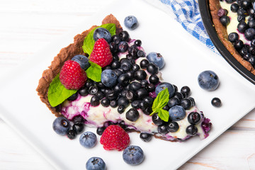 Delicious tart with blueberries and raspberries