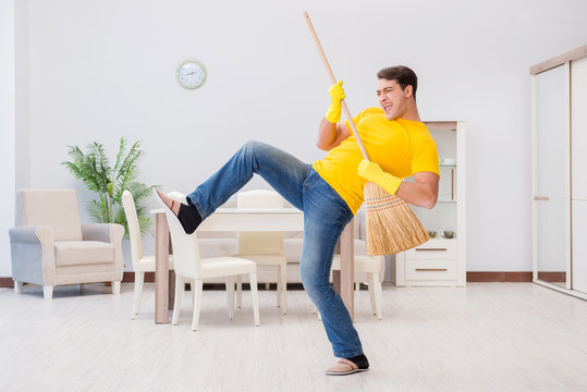 Young Man Doing Chores At Home