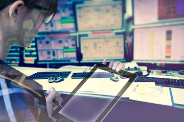 Double exposure of  women Engineer in hipster shirt  working with tablet in control room of oil and gas platform or plant industrial for monitor process, business and industry concept