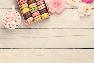 Colorful macaroons in a box and marshmallow