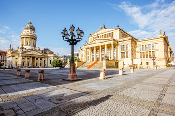 Viiew on the Gendarmenmarkt square with concert house building and German cathedral during the morning light in Berlin city - obrazy, fototapety, plakaty