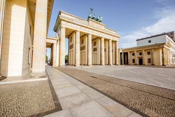 Fototapeta premium View on the famous Brandenburg gates on the Pariser square during the morning in Berlin city