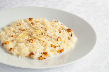 rice with onion, cheese and chanterelles cooked on broth and white wine