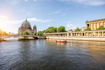 Sunrise view on the riverside with a National gallery building and cathedral in the old town of Berlin city