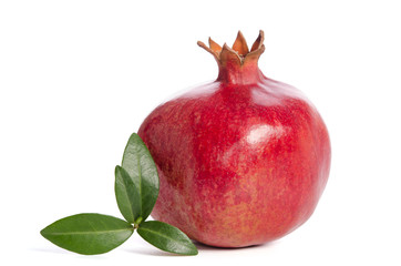 Ripe pomegranate with leaves