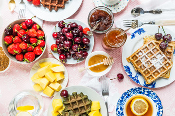Table Set for Breakfast with Waffles and Berries