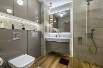 Modern bathroom with wooden floor