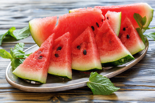 Juicy watermelon slices on a tray.