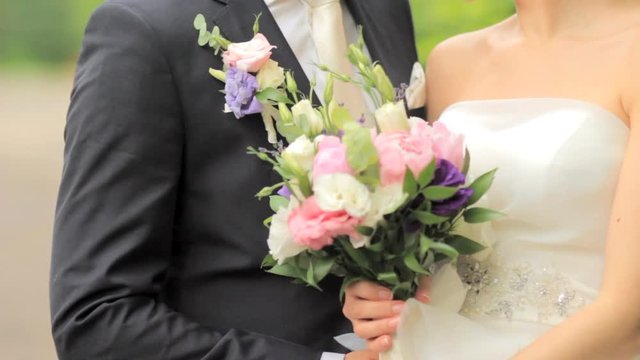 beautiful young couple just married on a walk. bride and groom on a bright background. Wedding day