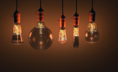 Decorative antique edison style light bulbs against wall background