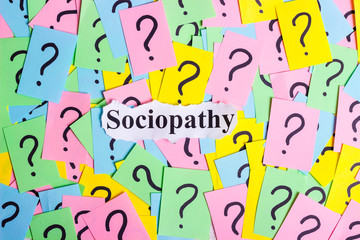 Sociopathy Syndrome text on colorful sticky notes Against the background of question marks