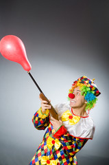 Funny clown in comical concept