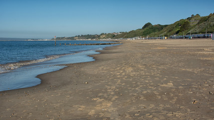 The deserted beach at the UK resort of Bournemouth in the early morning light before holiday makes arrive