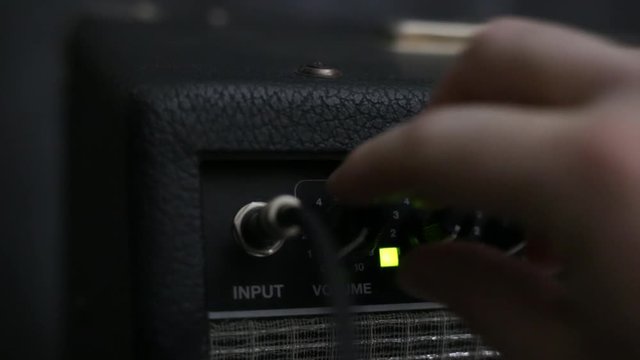 Powering On Guitar Amp and Turning Knobs