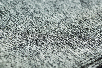 Texture of black and white fabric close-up, selective focus.