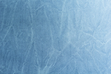 Texture of blue denim fabric close-up
