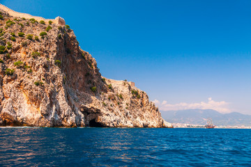 Fototapeta na wymiar Beautiful sea panorama landscape of Alanya Castle in Antalya district, Turkey, Asia. Famous tourist destination with high mountains. Summer bright day and sea shore