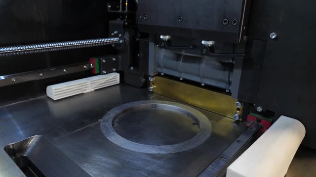 Automatic three dimensional 3d printer performs product creation. Modern 3D printing or additive manufacturing and robotic automation technology