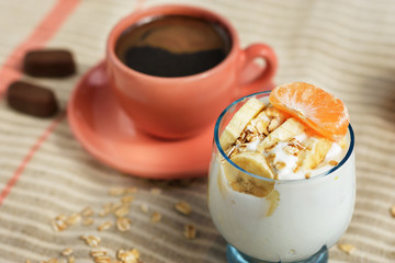 Banana yogurt and a cup of coffee for breakfast