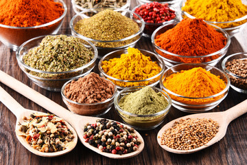 Variety of spices and herbs on kitchen table