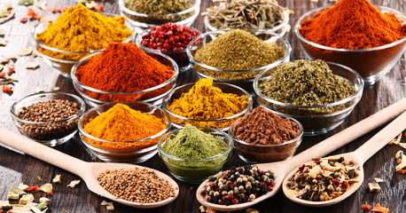 Variety of spices and herbs on kitchen table