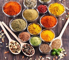 Variety of spices and herbs on kitchen table