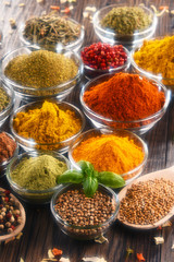 Variety of spices and herbs on kitchen table