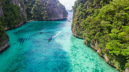 Fototapeta na wymiar Aerial drone view of iconic tropical turquoise water Pileh Lagoon surrounded by limestone cliffs, Phi Phi islands, Thailand