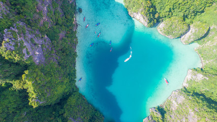 Aerial drone view of iconic tropical turquoise water Pileh Lagoon surrounded by limestone cliffs, Phi Phi islands, Thailand © stryjek